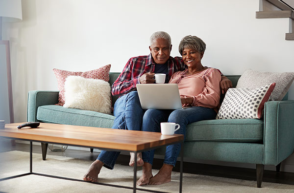 Senior couple browsing Medicare options online